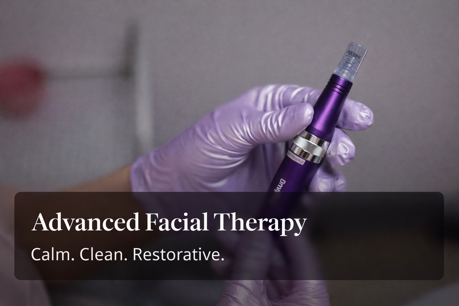 nn Gloved hand holding a purple facial therapy pen.