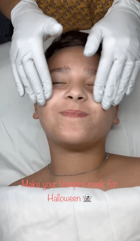 nn Hands in gloves gently touching face with text "Make your Vampire mask for Halloween".