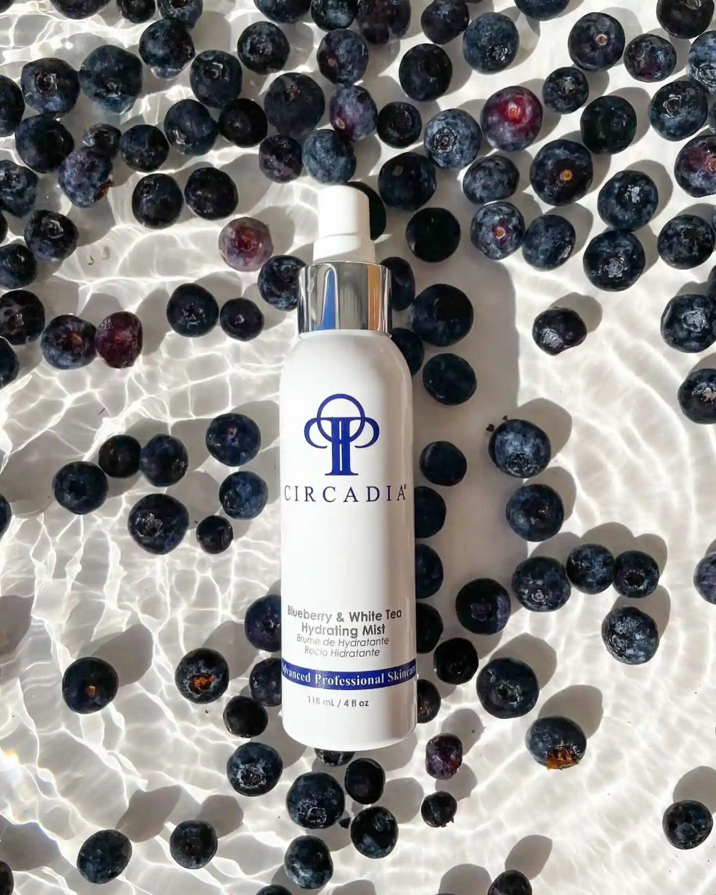 Circadia Blueberry & White Tea Hydrating Mist with blueberries.