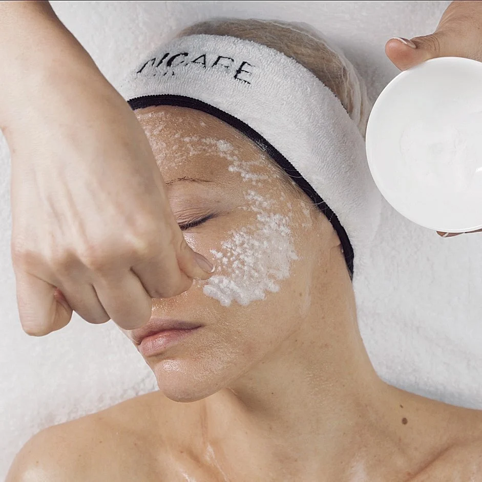 Facial scrub application at Skin Lounge Med Spa.