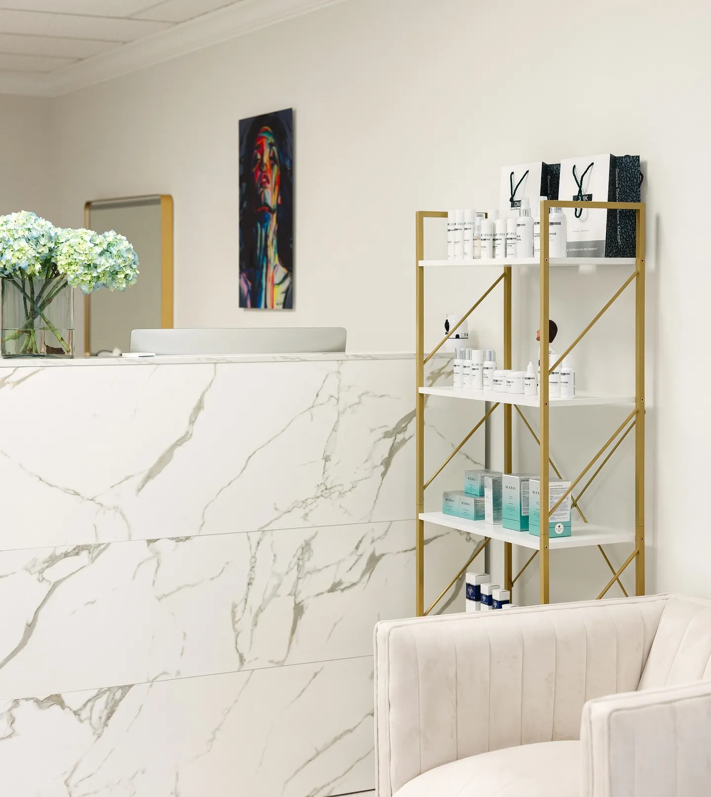 Reception desk, shelves with skincare products, and a chair.