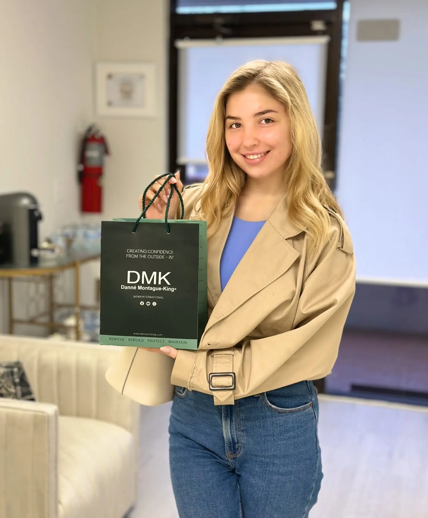 nn Woman holds DMK bag at Skin Lounge Med Spa, Boca Raton.